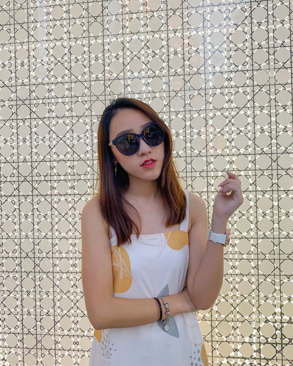 Model wearing navy sunglasses