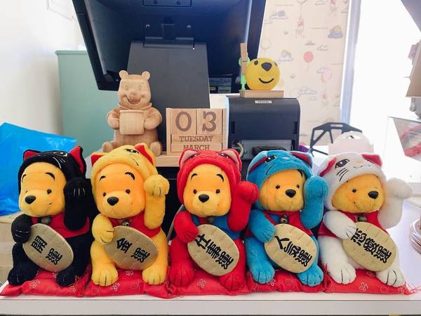cashier counterwith Winnie-The-Pooh plush toys
