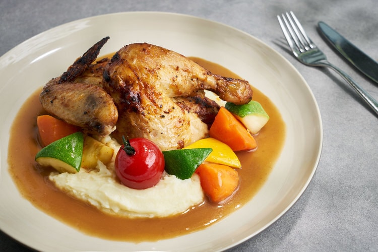 roast chicken and vegetables on mashed potatoes