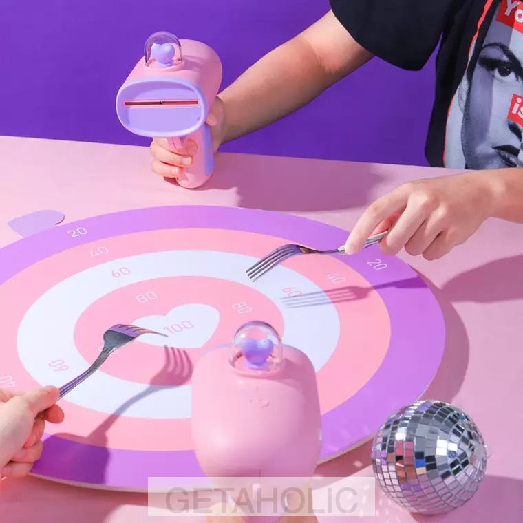 pastel pink gun shooting heart-shaped cards