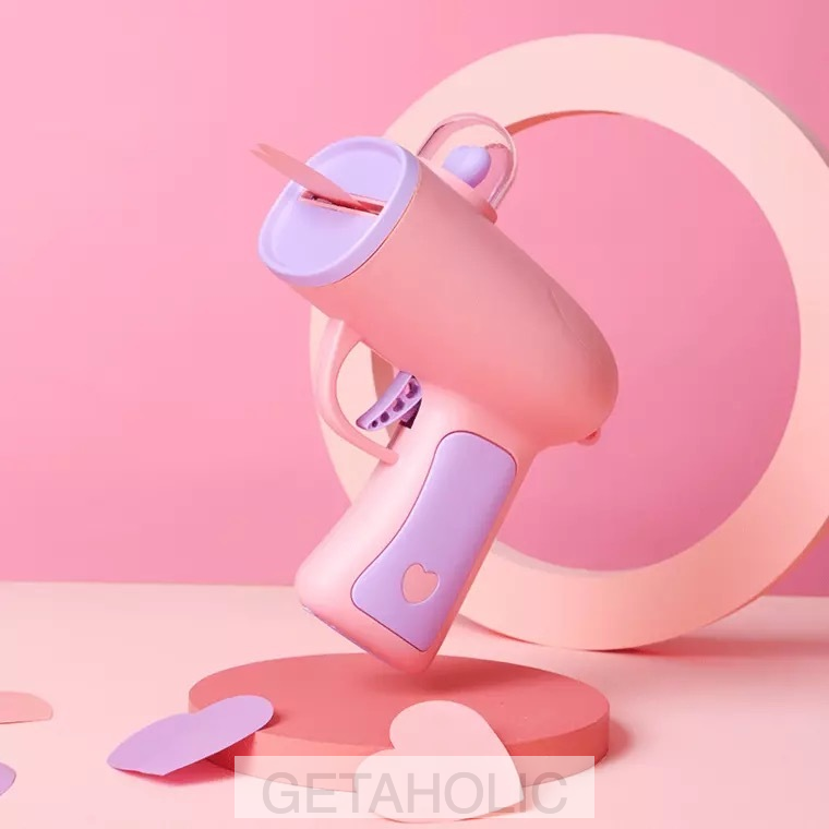 pastel pink gun shooting heart-shaped cards
