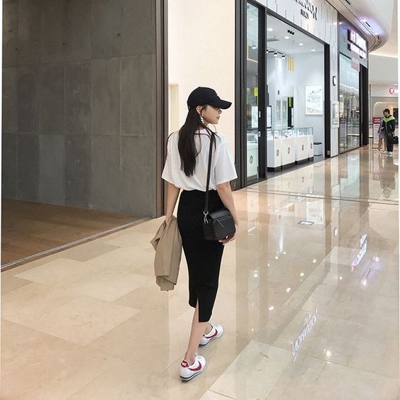 asian girl walking in a mall