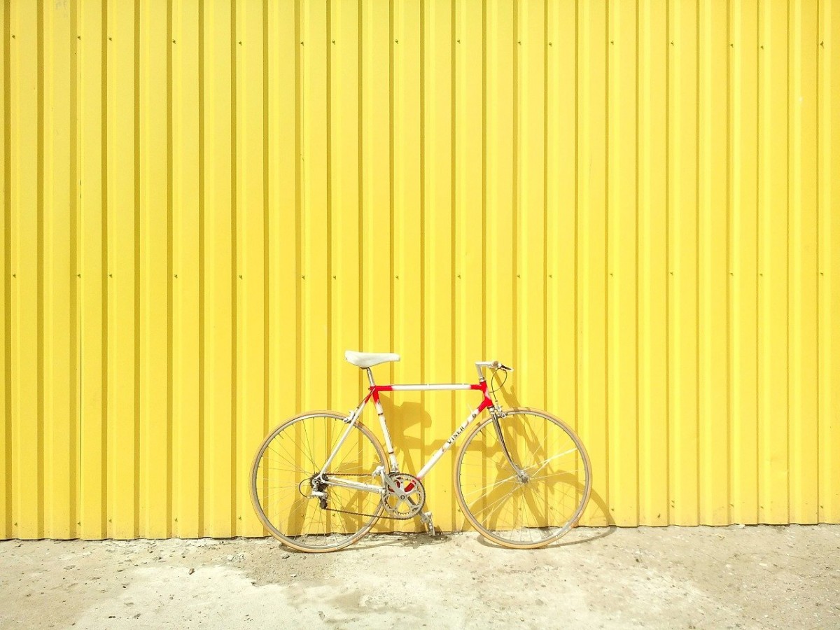 bicycle against a yellow wall