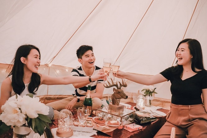 friends eating in glamping tent at Jewel Changi Airport