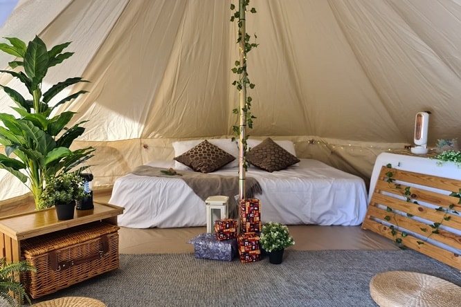 bed inside glamping tent