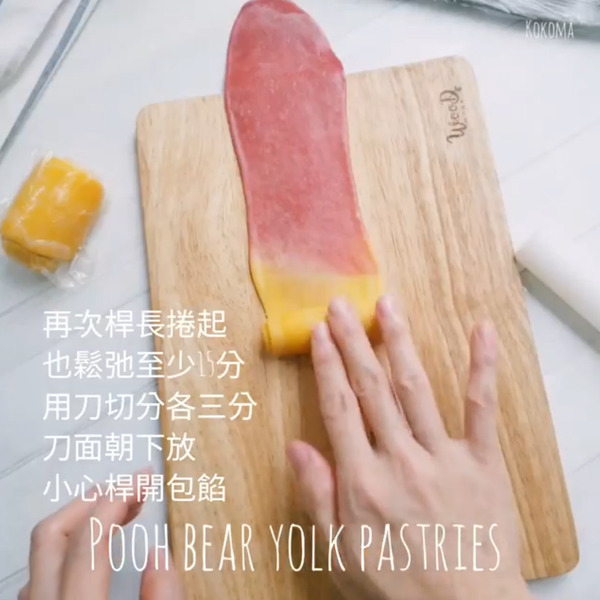 rolling red and yellow dough