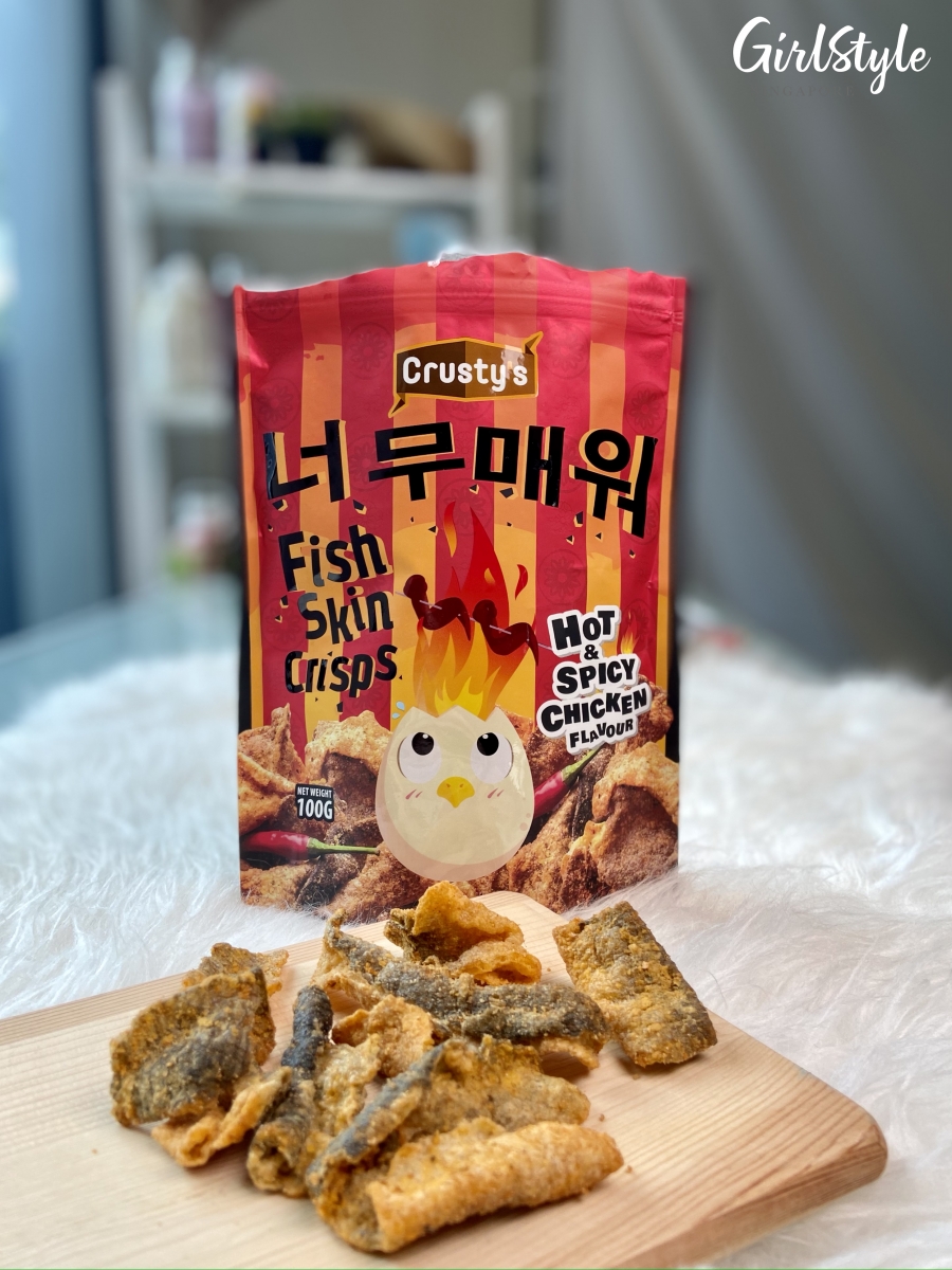 Crusty's Hot & Spicy fish skin crisps on a wooden board