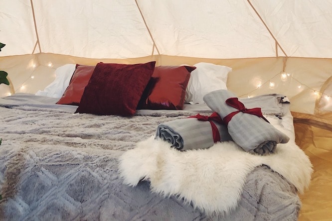 bed inside glamping tent
