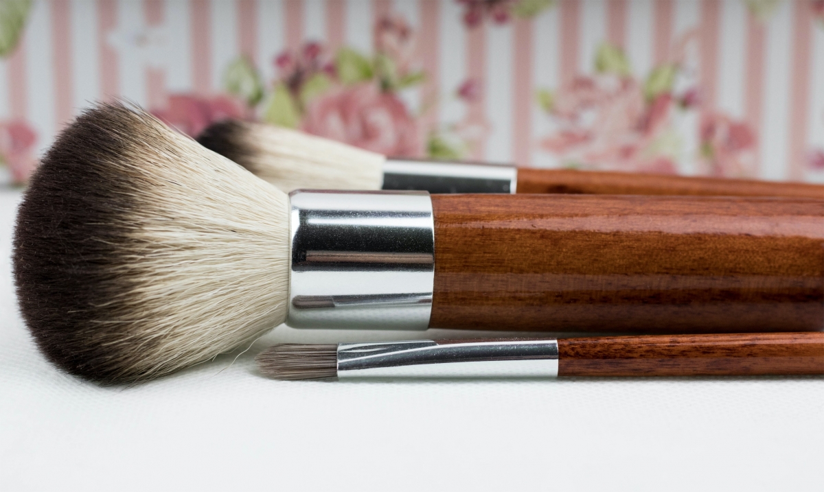 Side view of wooden makeup brushes