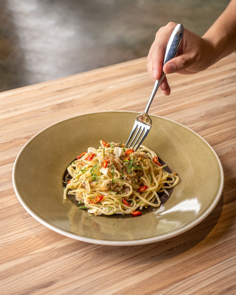 plate of Crabmeat Aglio Olio with fork