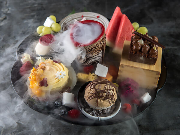 plate of assorted desserts at CÉ LA VI Restaurant and SkyBar