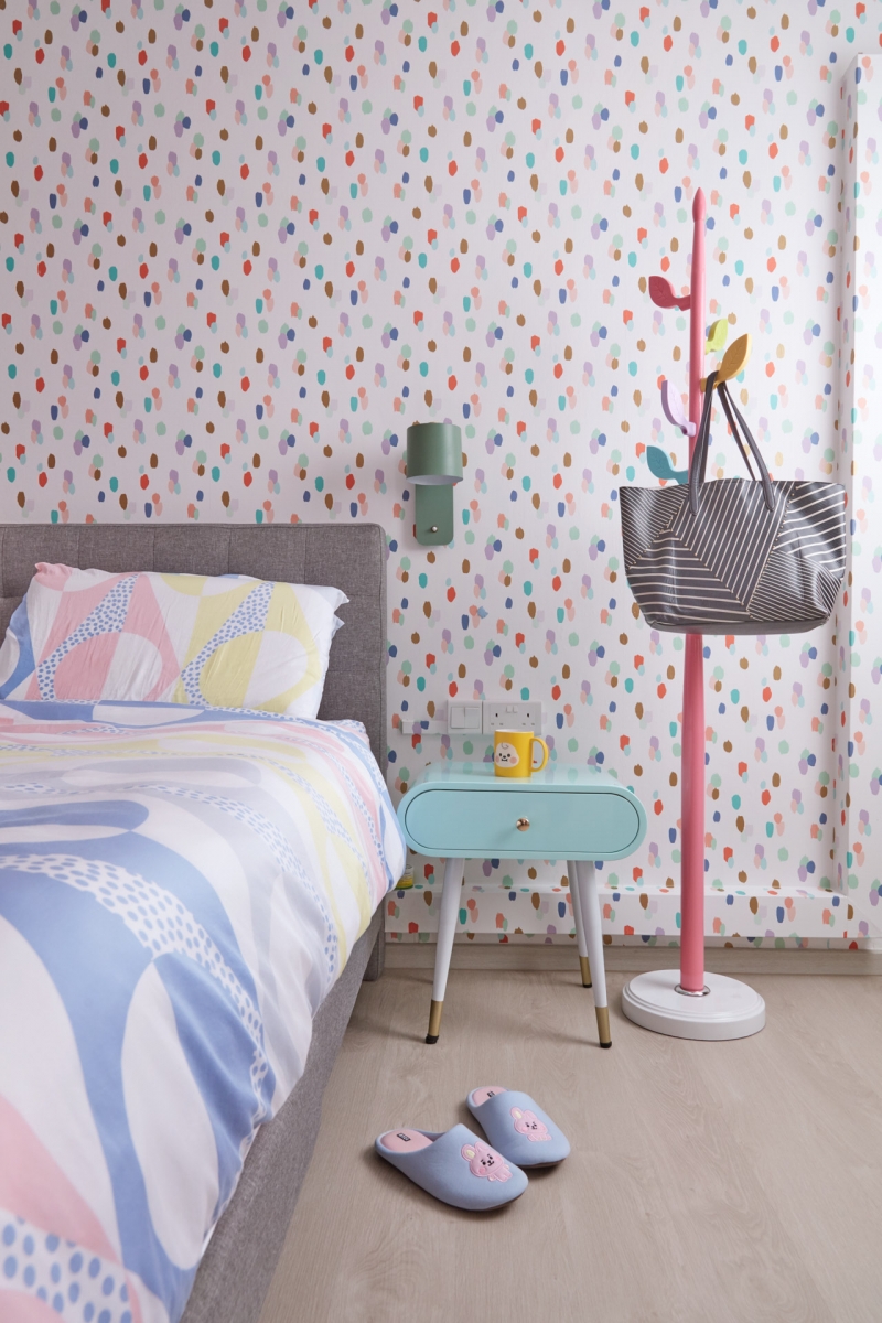 pastel hdb bedroom with polka dot wallpaper