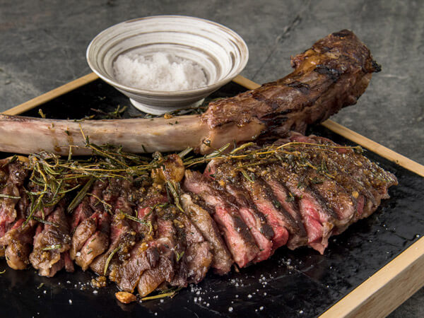 steak on bone at CÉ LA VI Restaurant and SkyBar