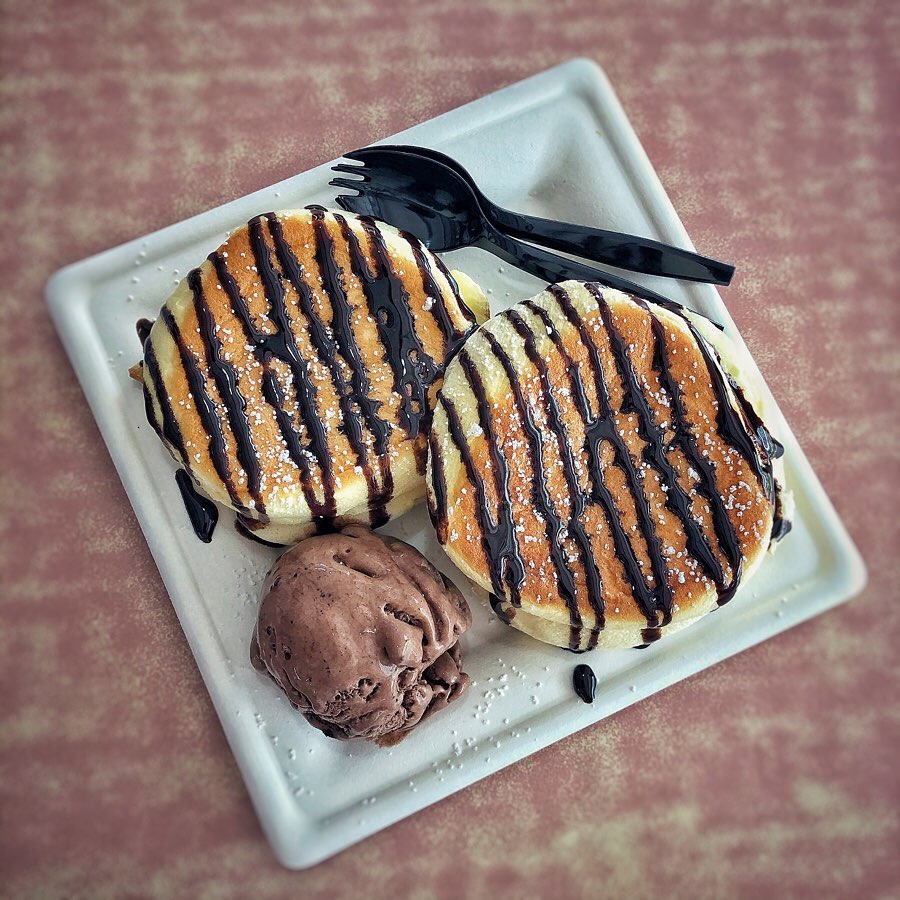 sweet.rex souffle pancakes with chocolate syrup and ice cream