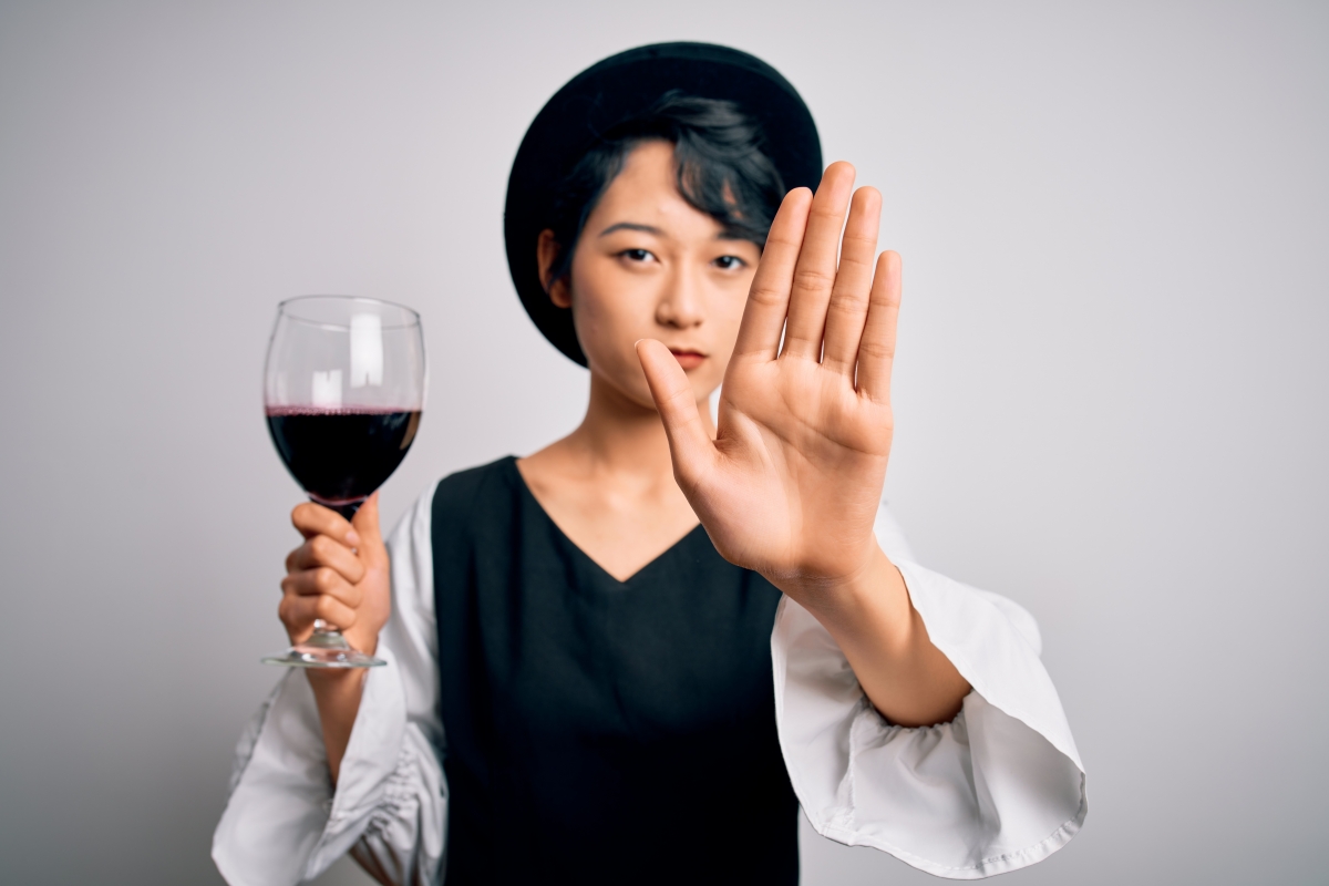 Girl saying no to a glass of wine
