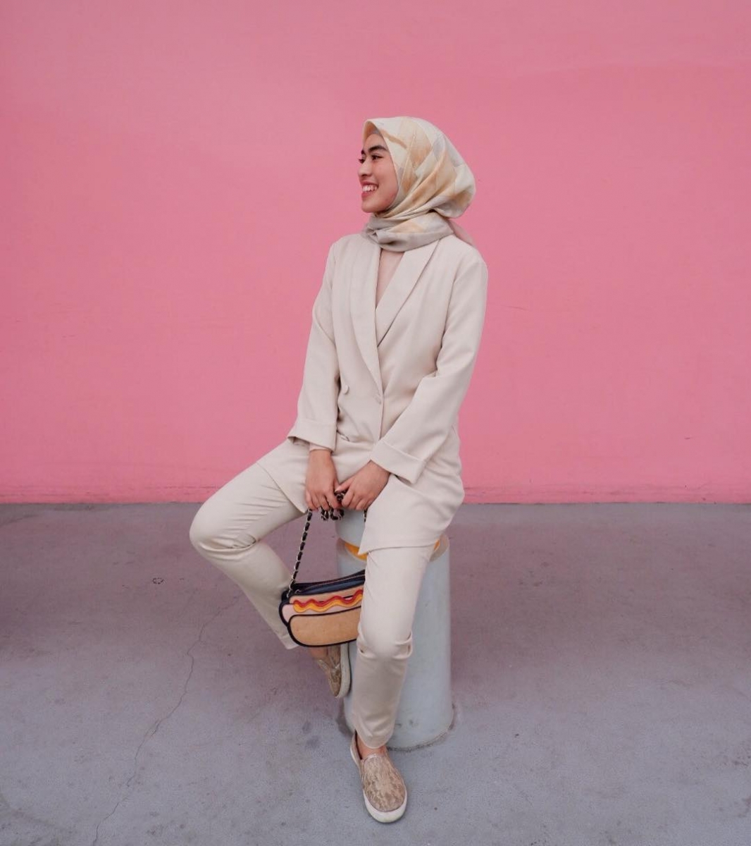 muslim woman wearing all pink outfit with blazer and trousers