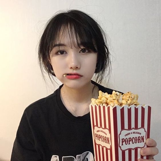 Girl eating popcorn