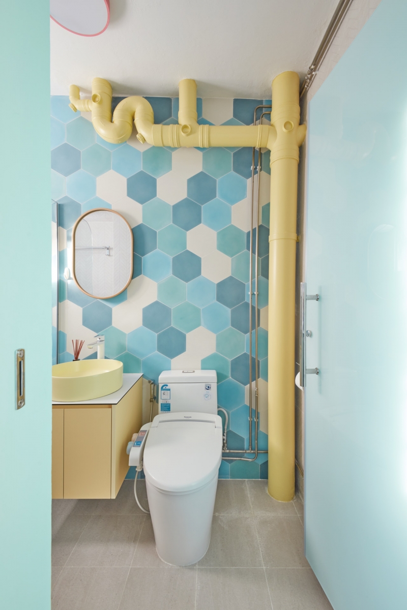 pastel blue and yellow hdb toilet