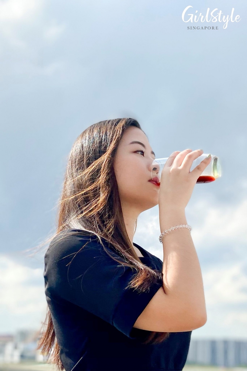 Editor drinking Hao Yi Kang Lao Xie Zhen Collagen Beauty Essence