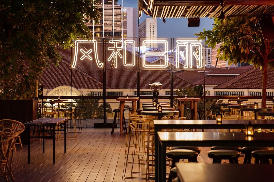 neon mandarin characters at loof rooftop bar singapore