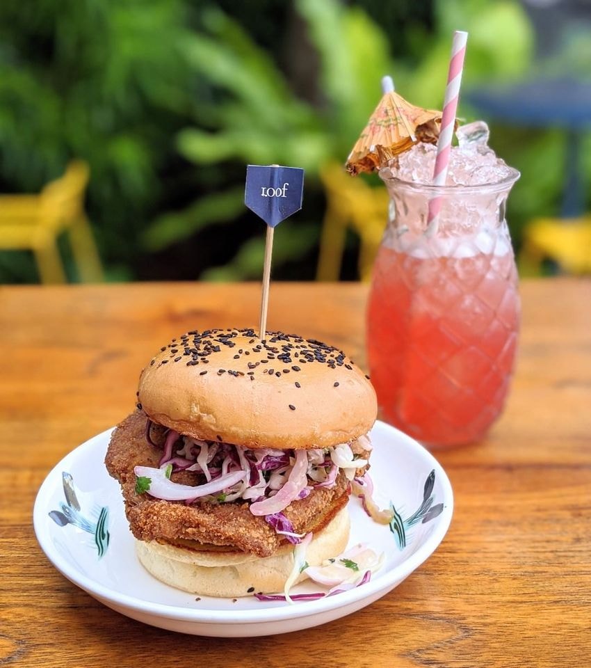 burger and singapore sling at loof rooftop bar singapore