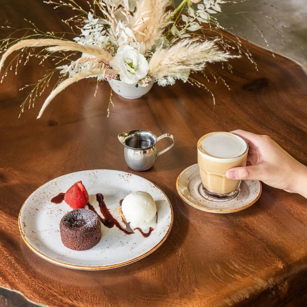 Chocolate Lava Cake with vanilla ice cream and coffee