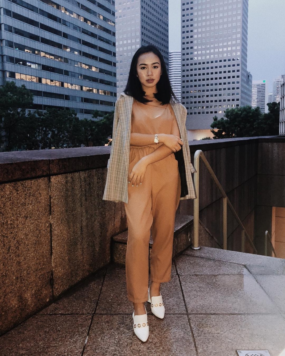 asian girl wearing peach jumpsuit and houndstooth blazer