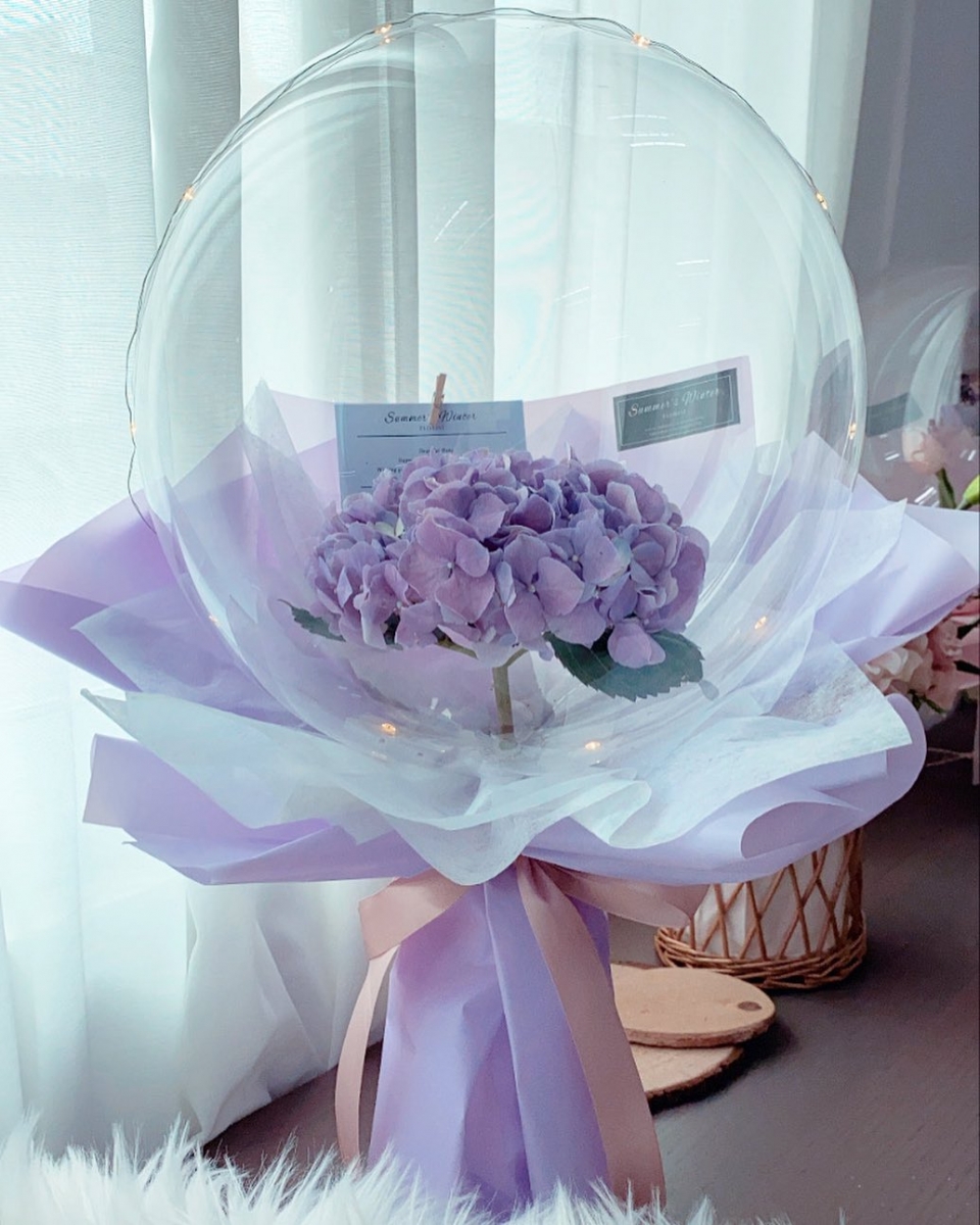 Summer's Winter balloon bouquet with fairy lights