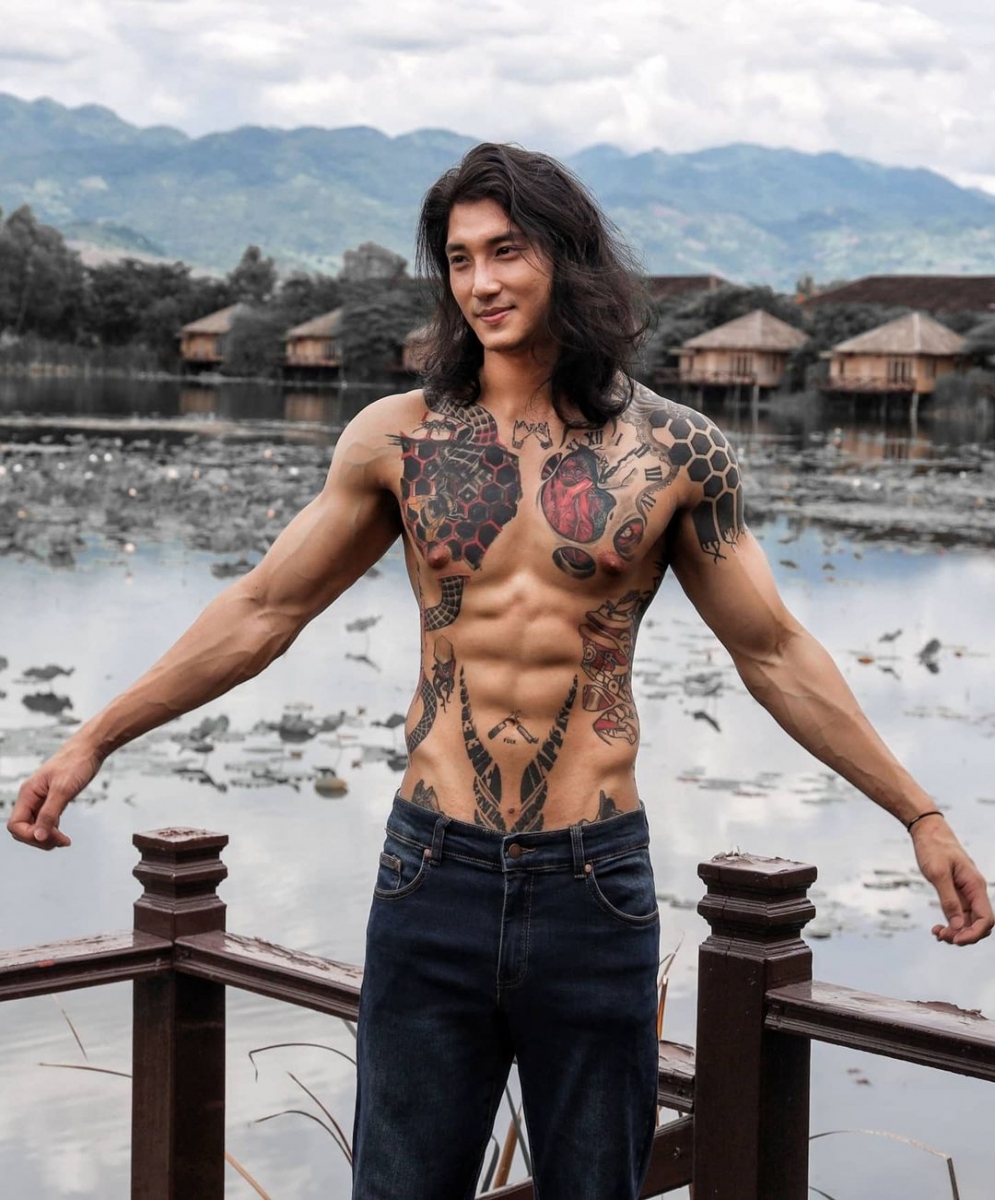 shirtless paing takhon with chest tattoos