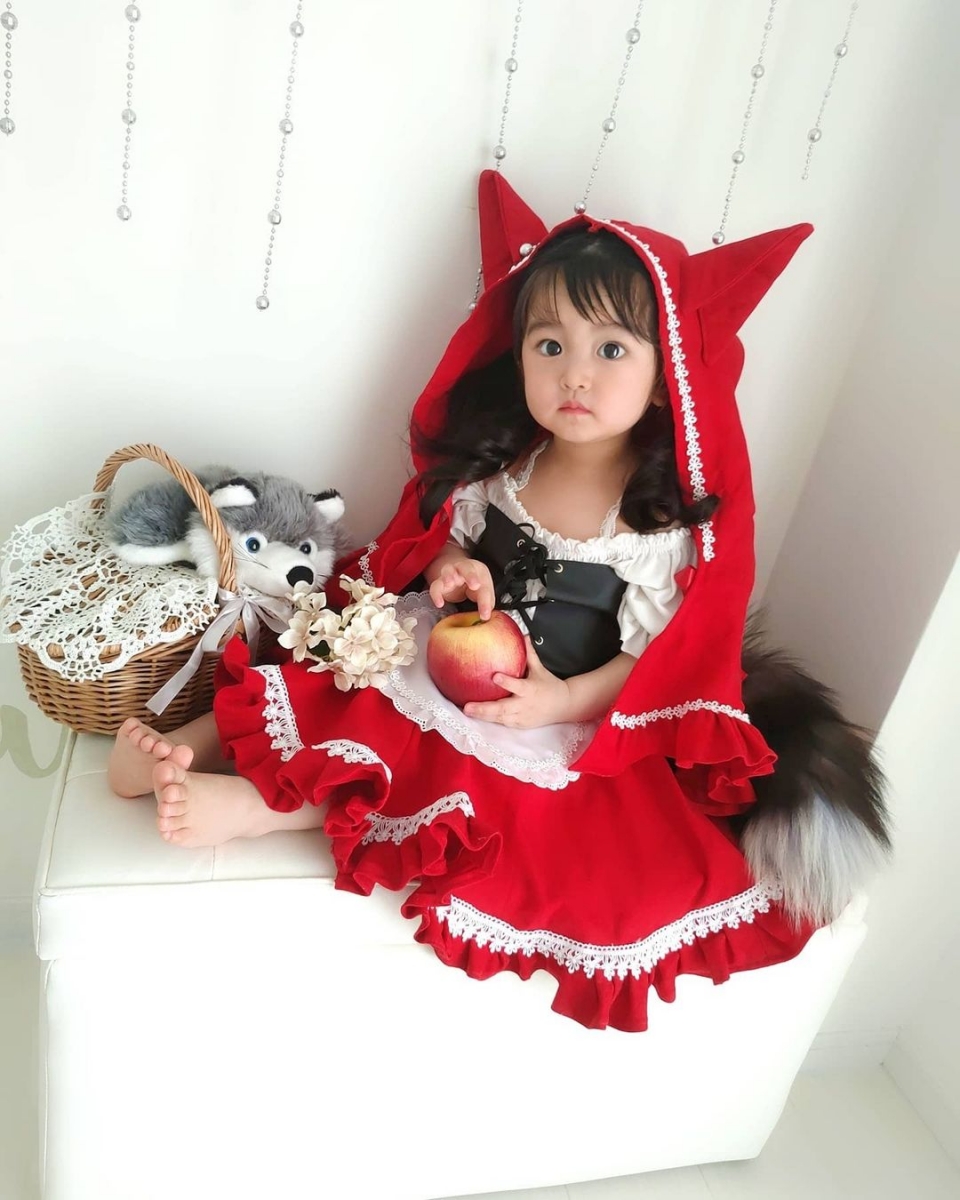 asian baby dressed as red riding hood