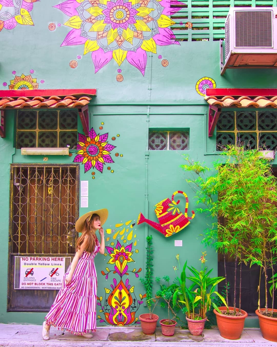 green wall with illustrations at muscat street singapore