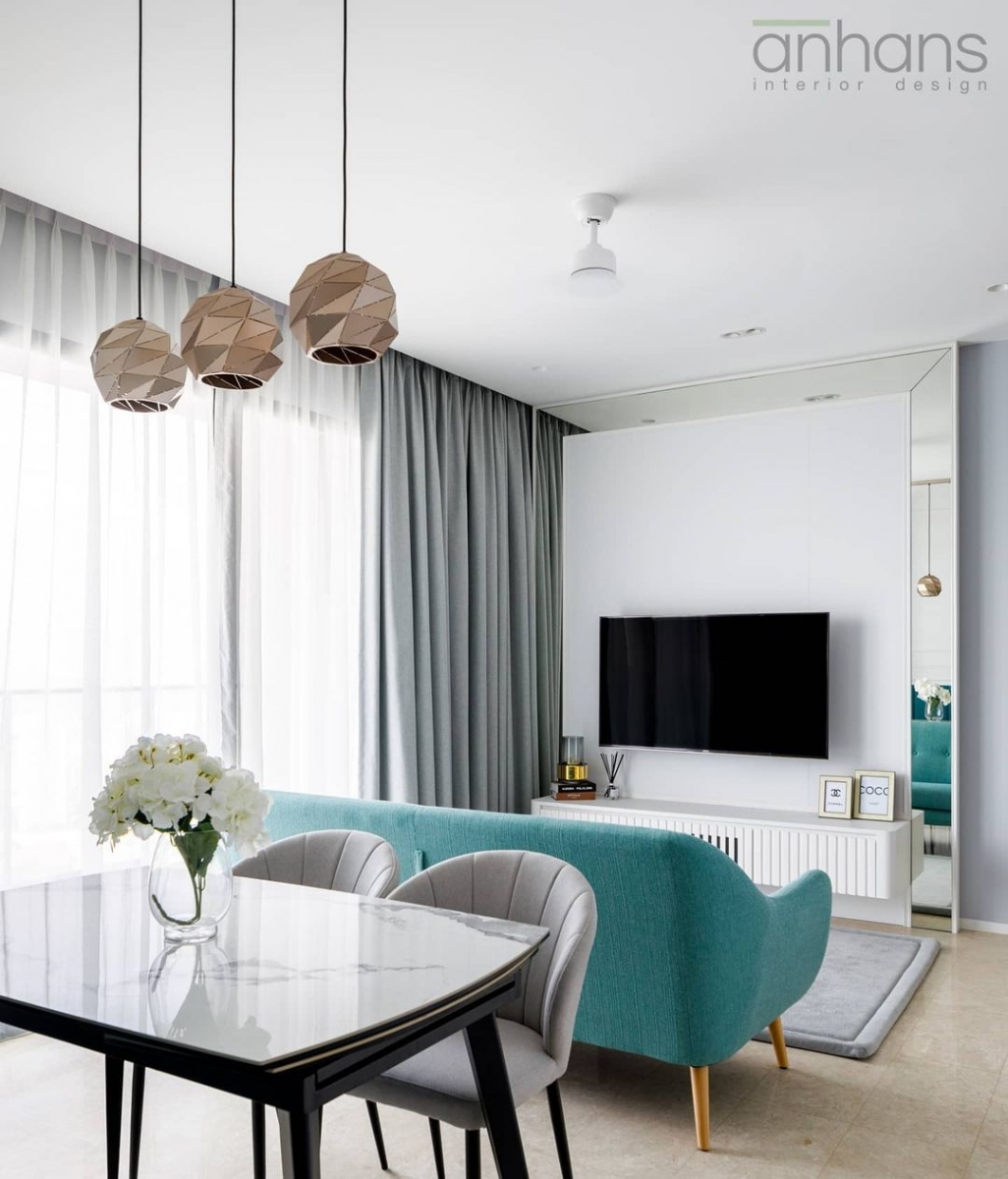 teal and white living room and breakfast dining nook in singapore