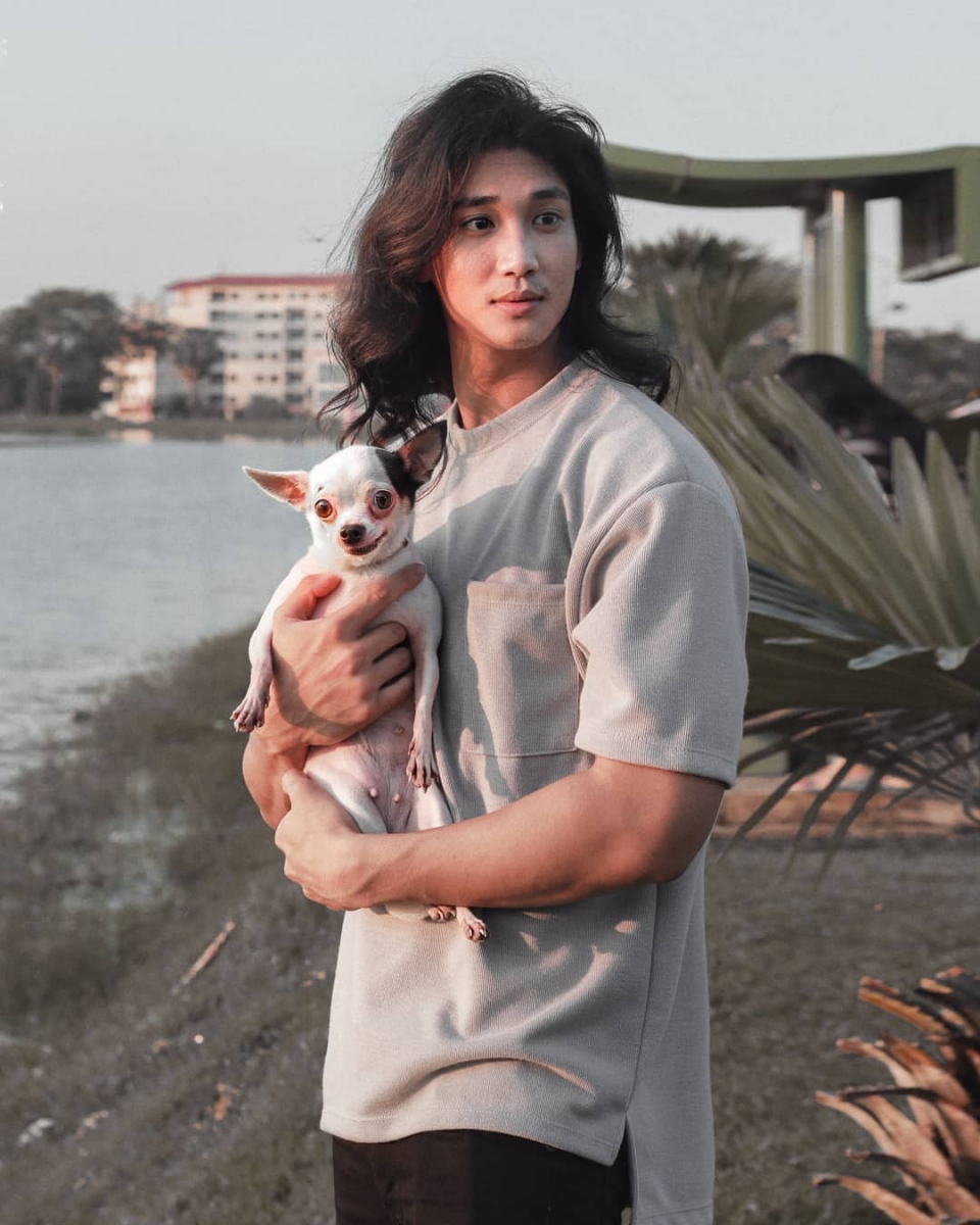 paing takhon holding a puppy