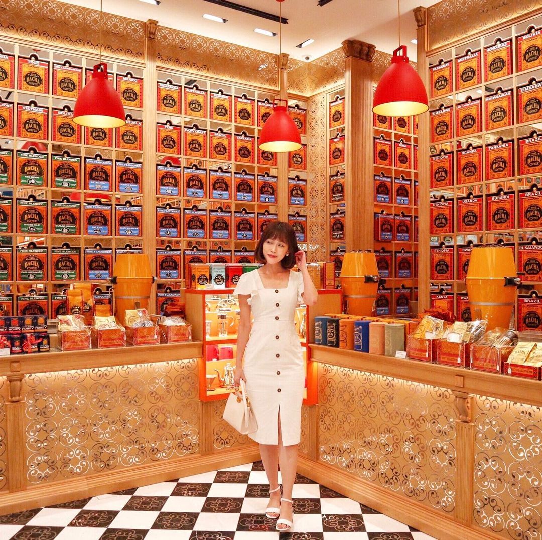 bacha coffee cafe gold wall of tins