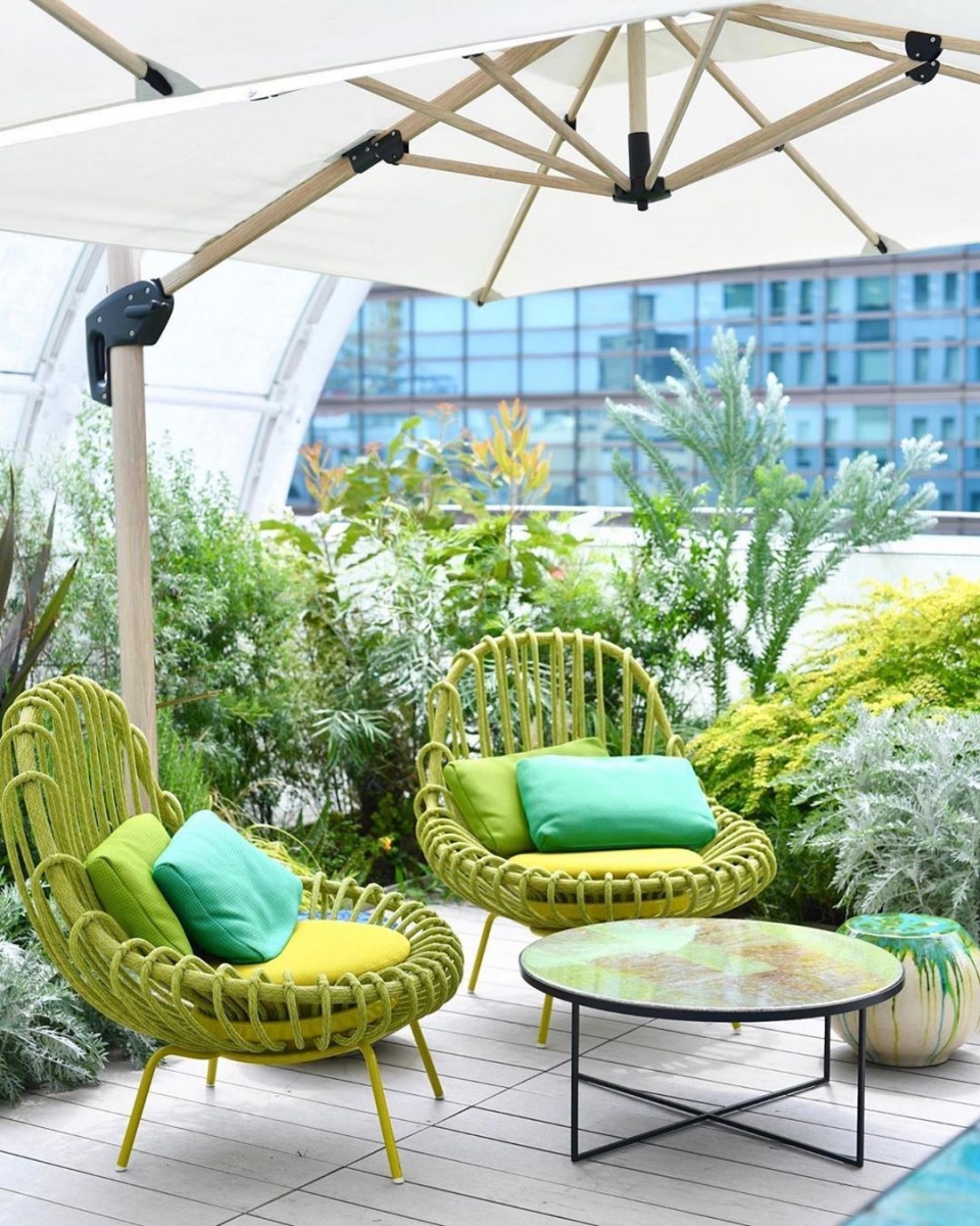 Louis Vuitton Le Cafe V green outdoor seating area