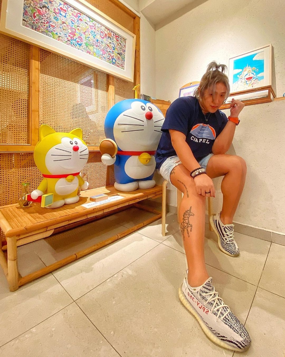doraemon sitting on bench at Tong Xin Ru Yi Traditional Hotpot restaurant in singapore