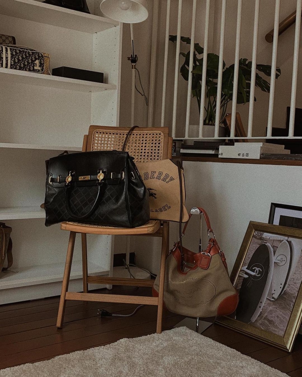 black vintage luxury bag on chair