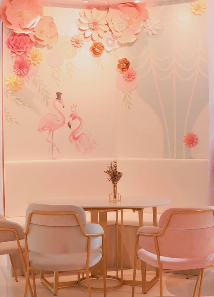 YTEA pink bubble tea cafe with floral wall
