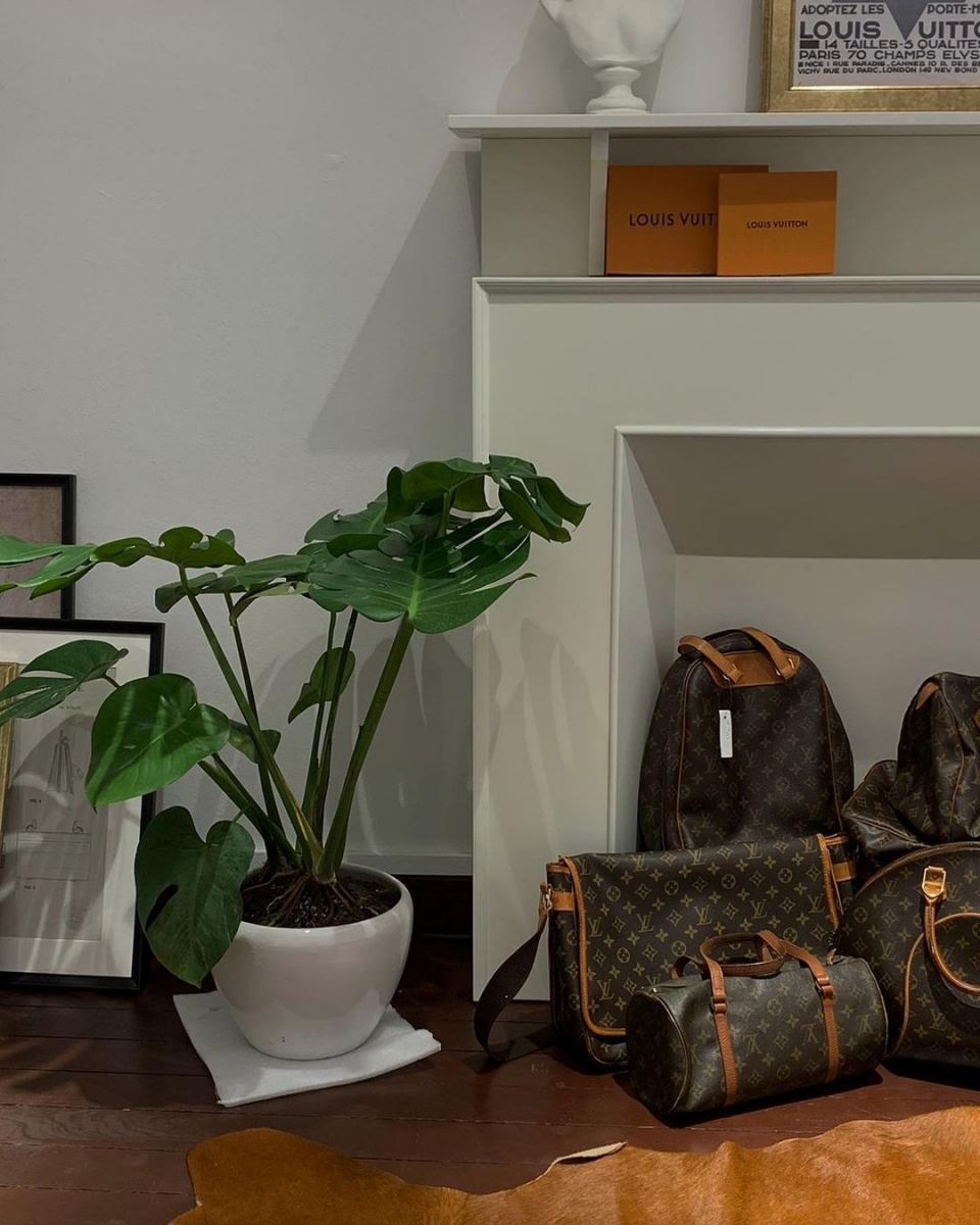 vintage louis vuiton bags on faux fireplace