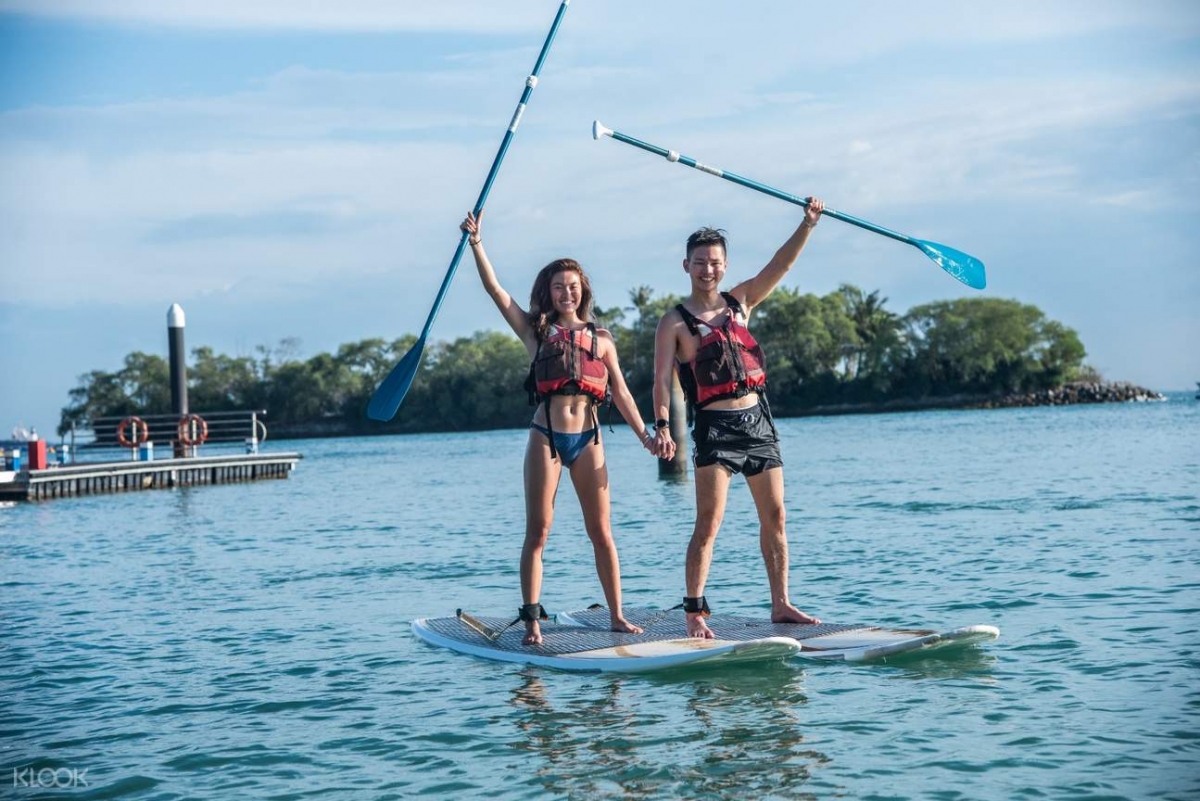 Ola Beach Club paddle boarding