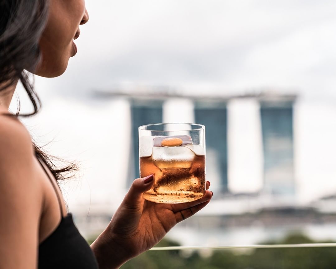 Girl drinking at Smoke & Mirrors