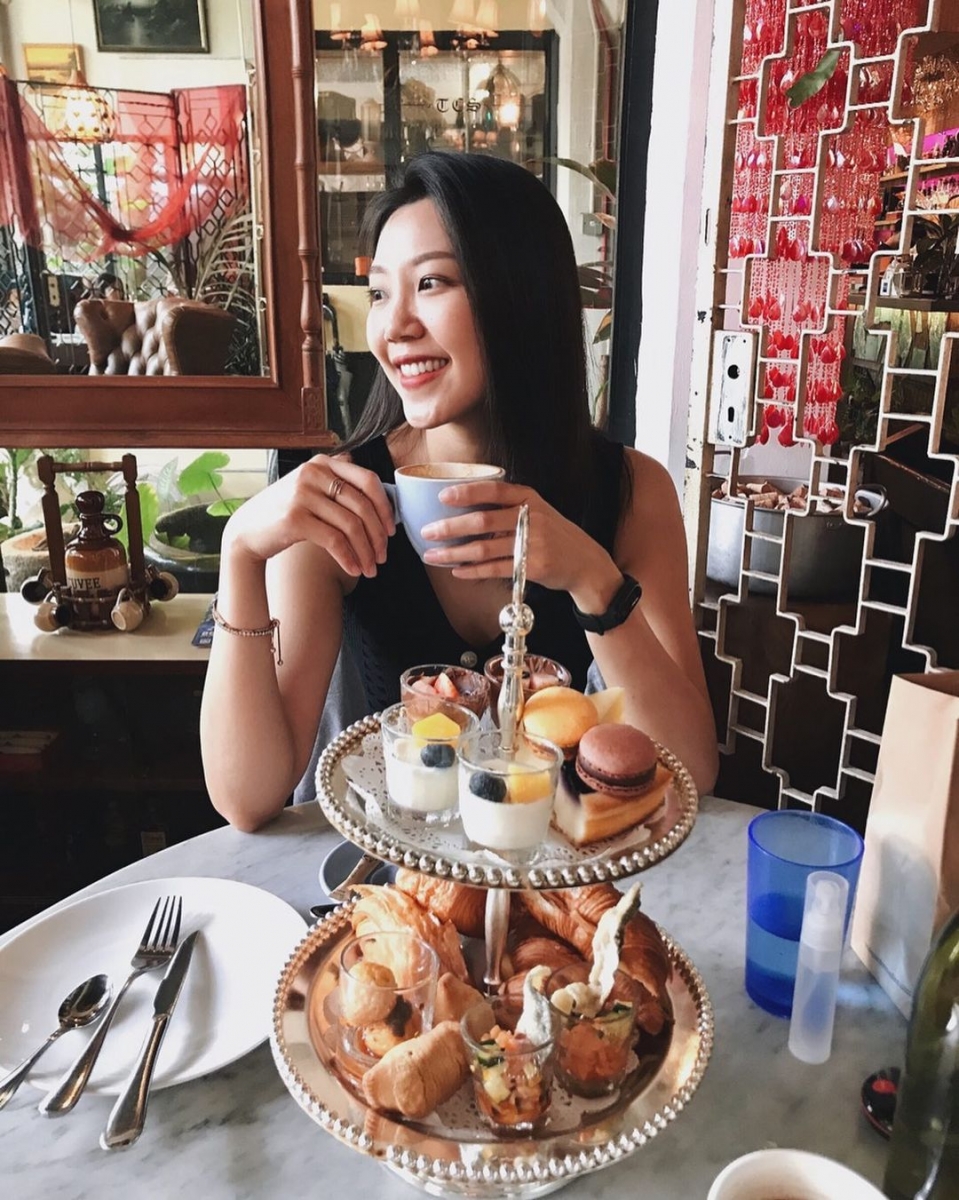 Sipping on tea while having high tea at The Coastal Settlement