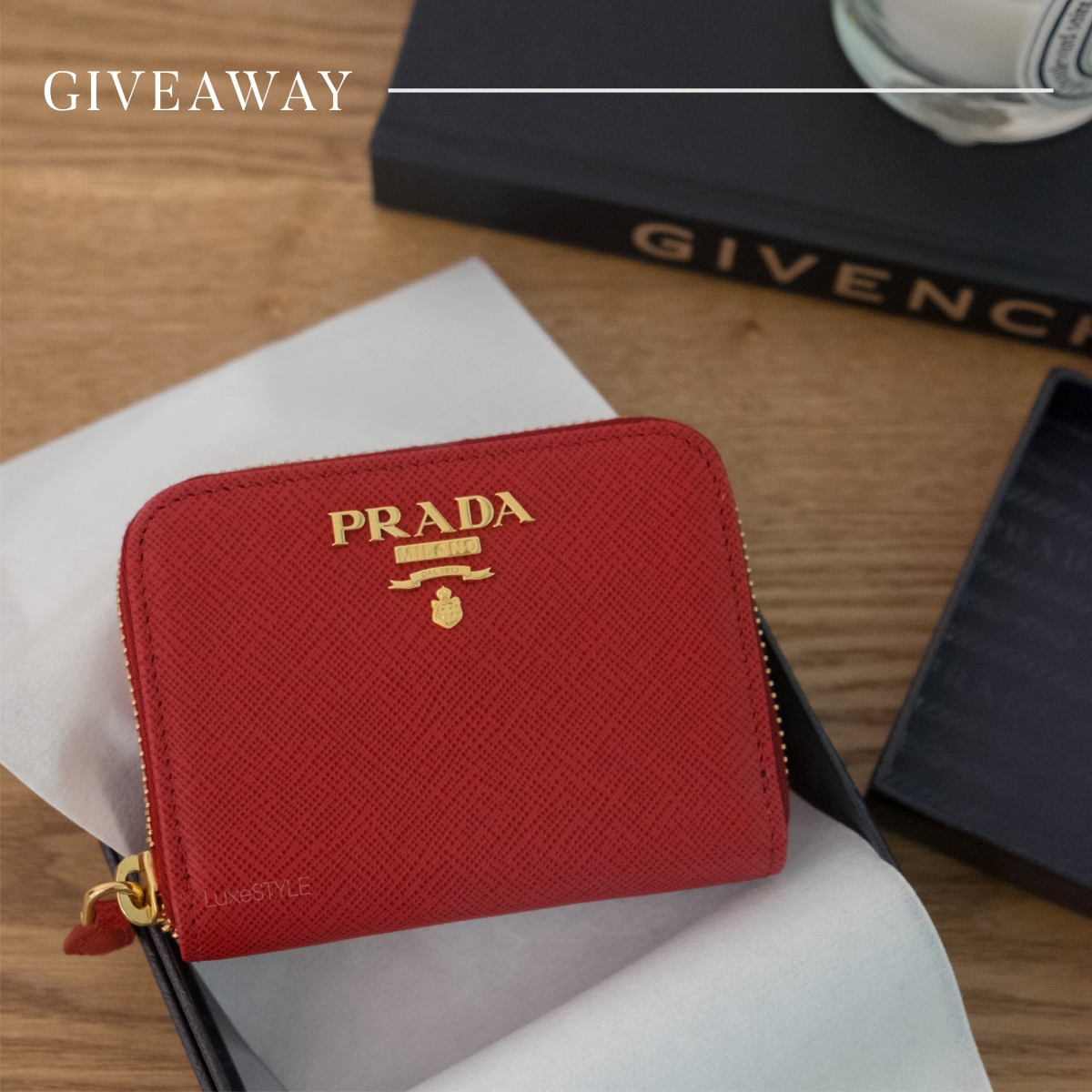 red prada mini purse with gold hardware in box