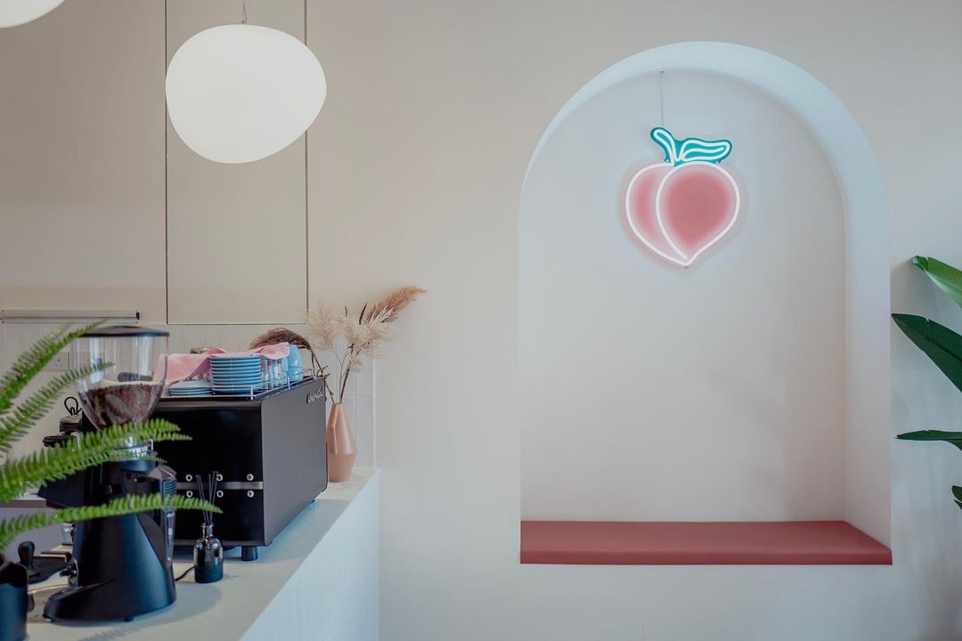 Peach neon light at Sweet Cheeks