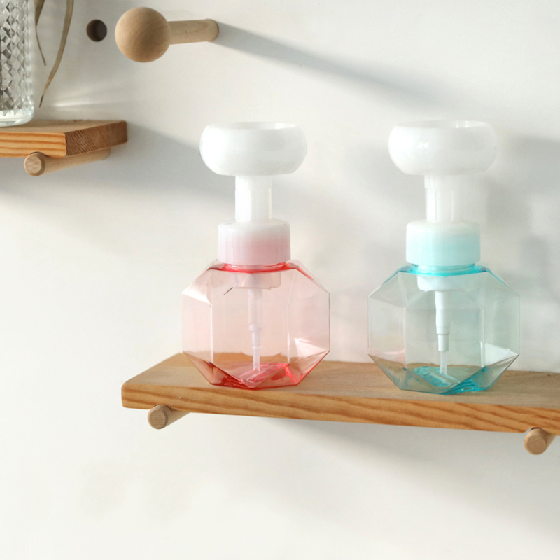 Flower stamp soap bottle on a ledge