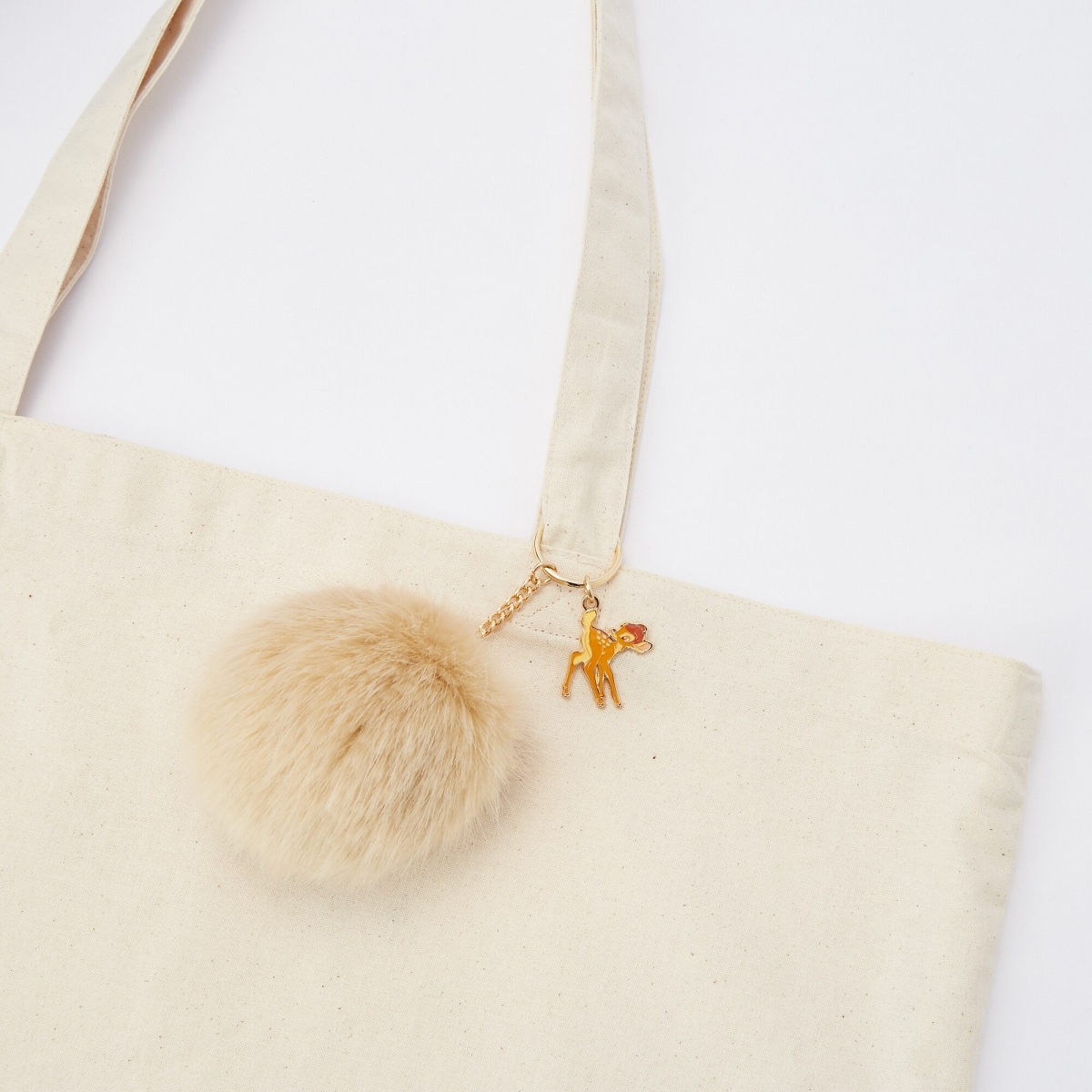 uniqlo singapore disney bambi key chain pompom on bag