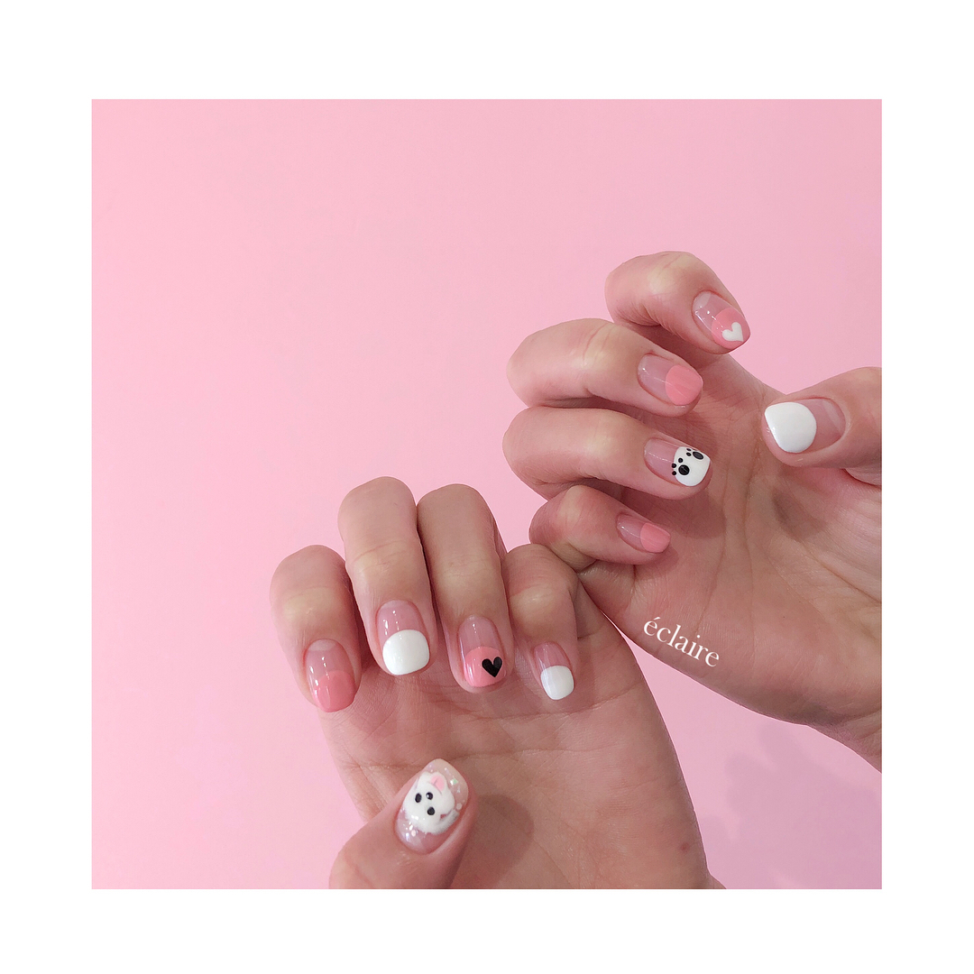 pink and white Bichon Frise nail art