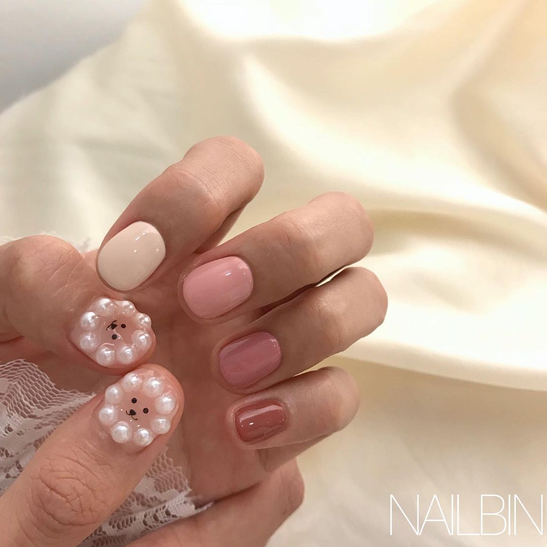 pink and pearl poodle nail art