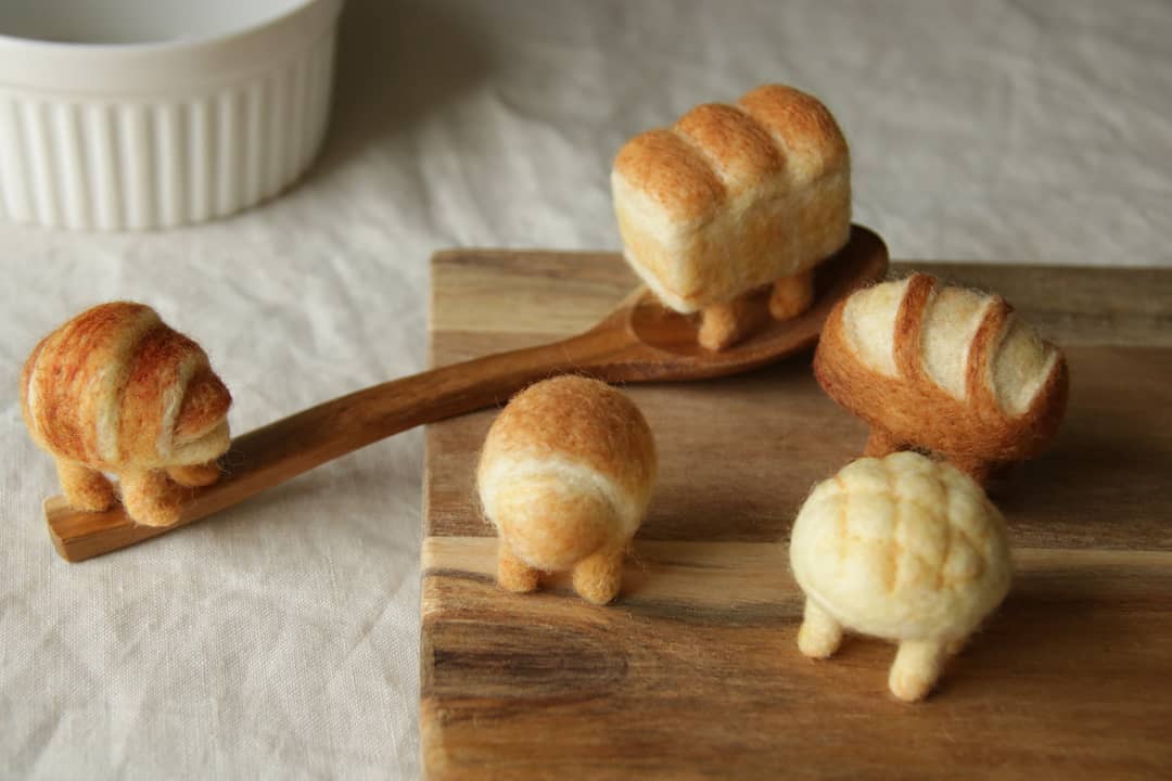 atelierhatena wool felt figures of bread with legs on kitchen table