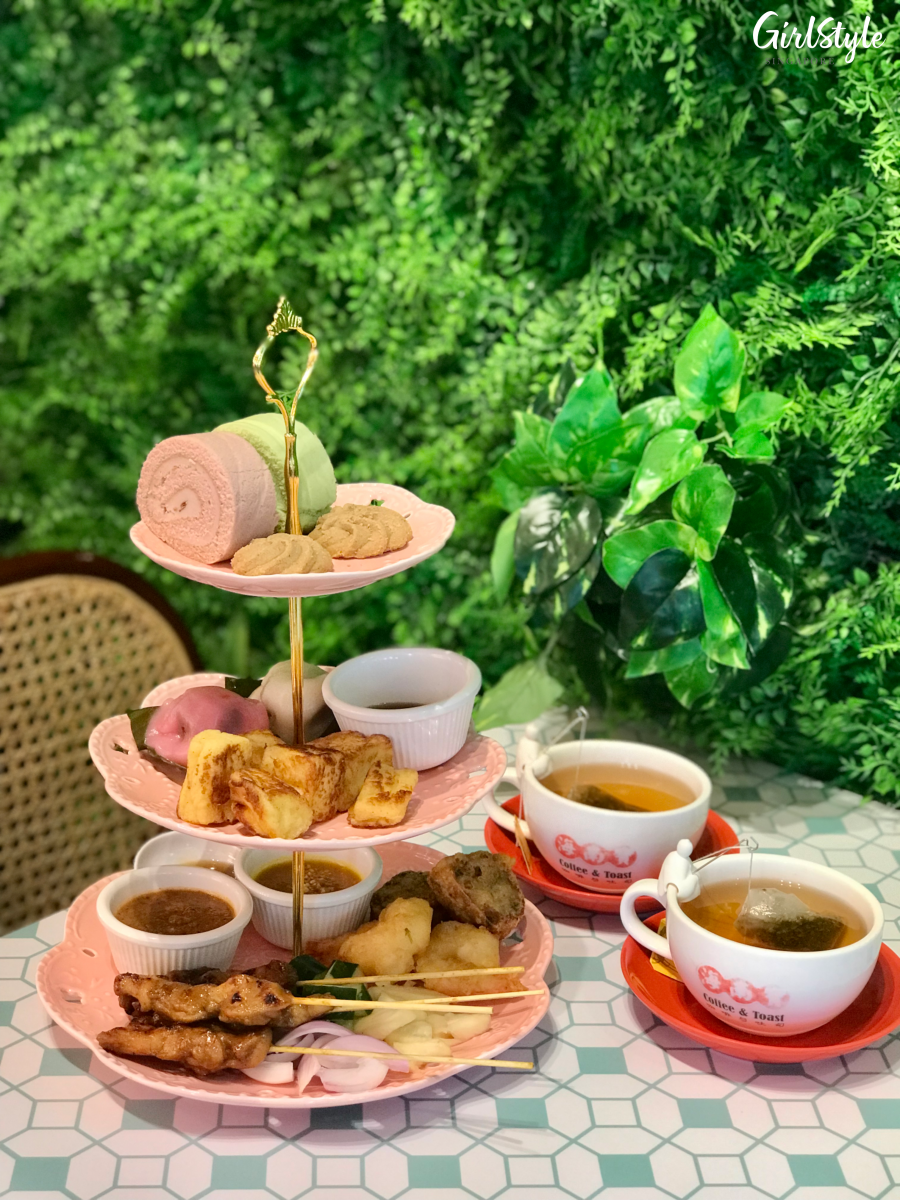 The Hainan Story Hainanese high tea set on a three tiered stand and two cups of coffee